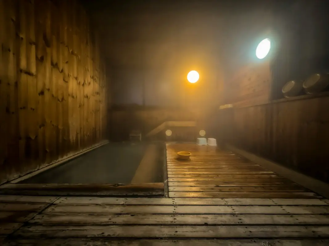 tattoo friendly onsen Tokyo indoor bath night atmosphere