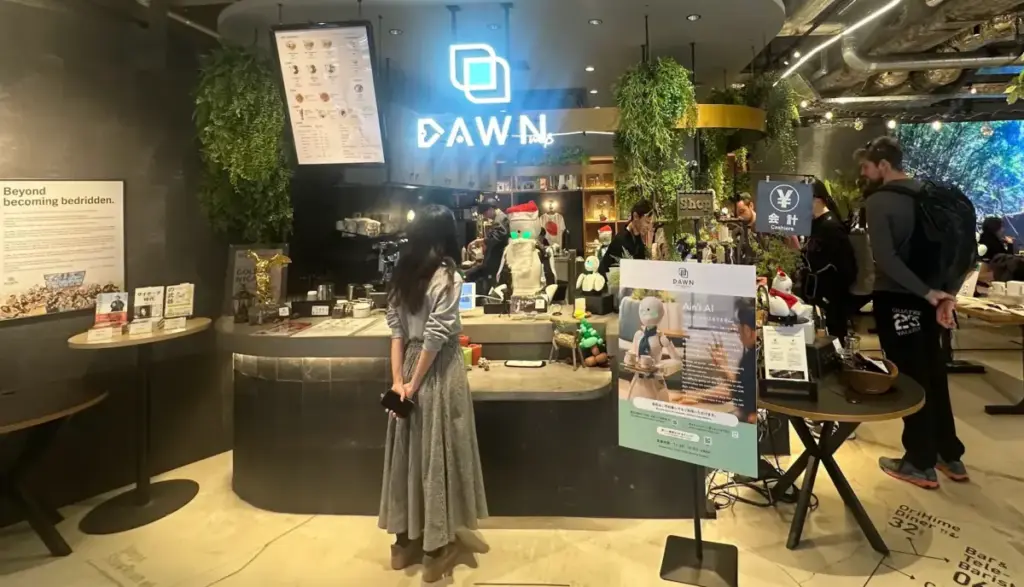 スクリーンショット 2026-01-04 17.42.13 Interior of DAWN Avatar Robot Cafe in Tokyo with OriHime robots serving guests