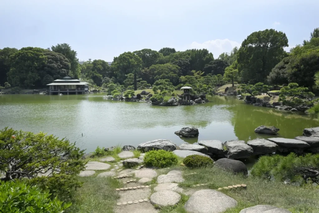Traditional Japanese garden in Tokyo with a peaceful pond and seasonal greenery