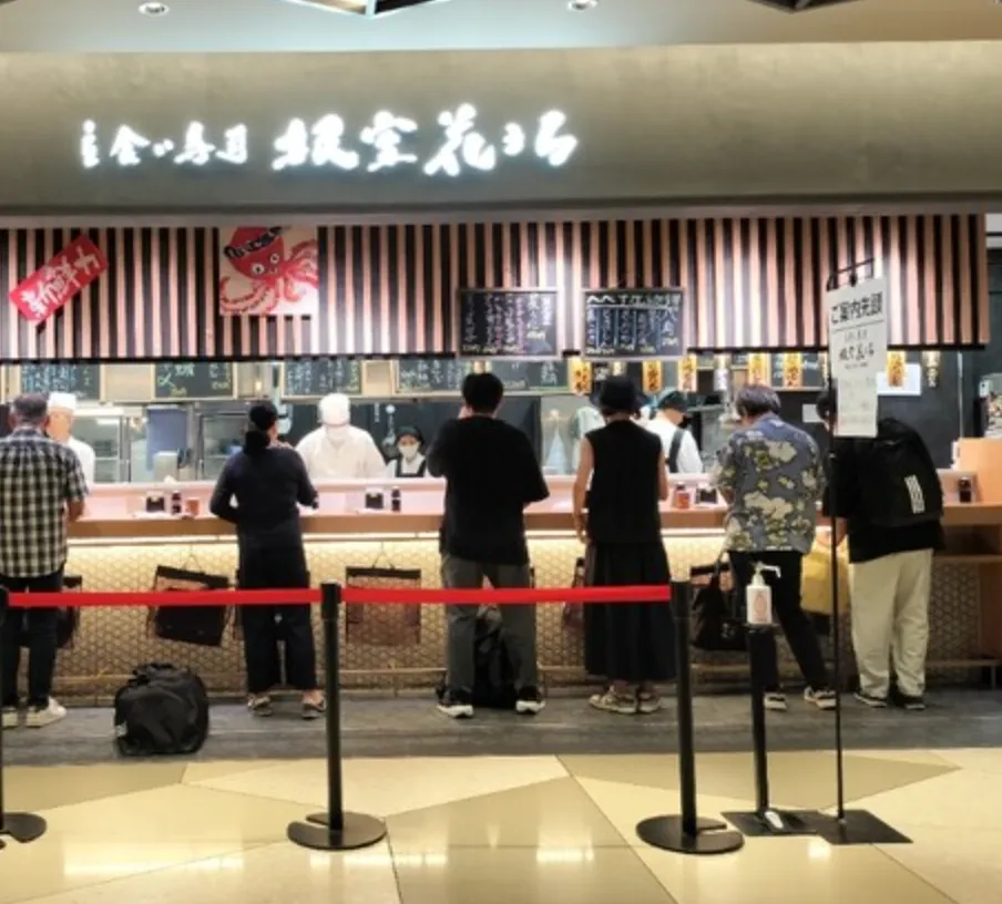 Standing sushi bar in Tokyo where locals enjoy quick and affordable sushi