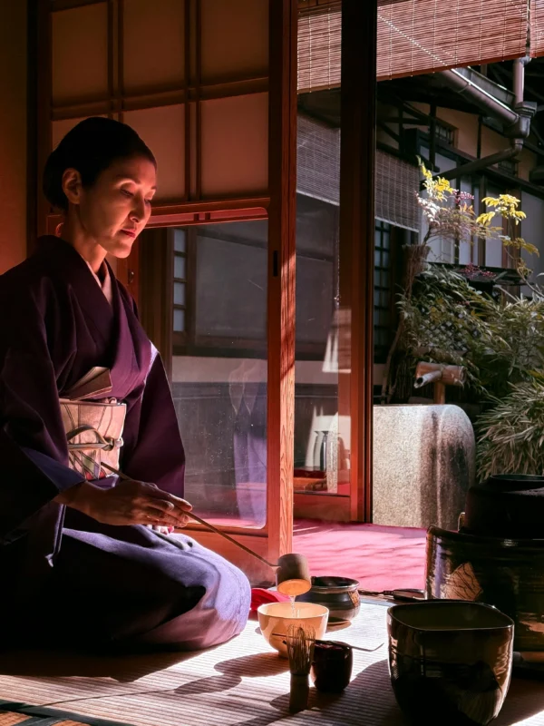 tiago-ebisui-TmgR2If58HM-unsplash Whisking matcha tea creating foam during traditional Japanese tea ceremony preparation