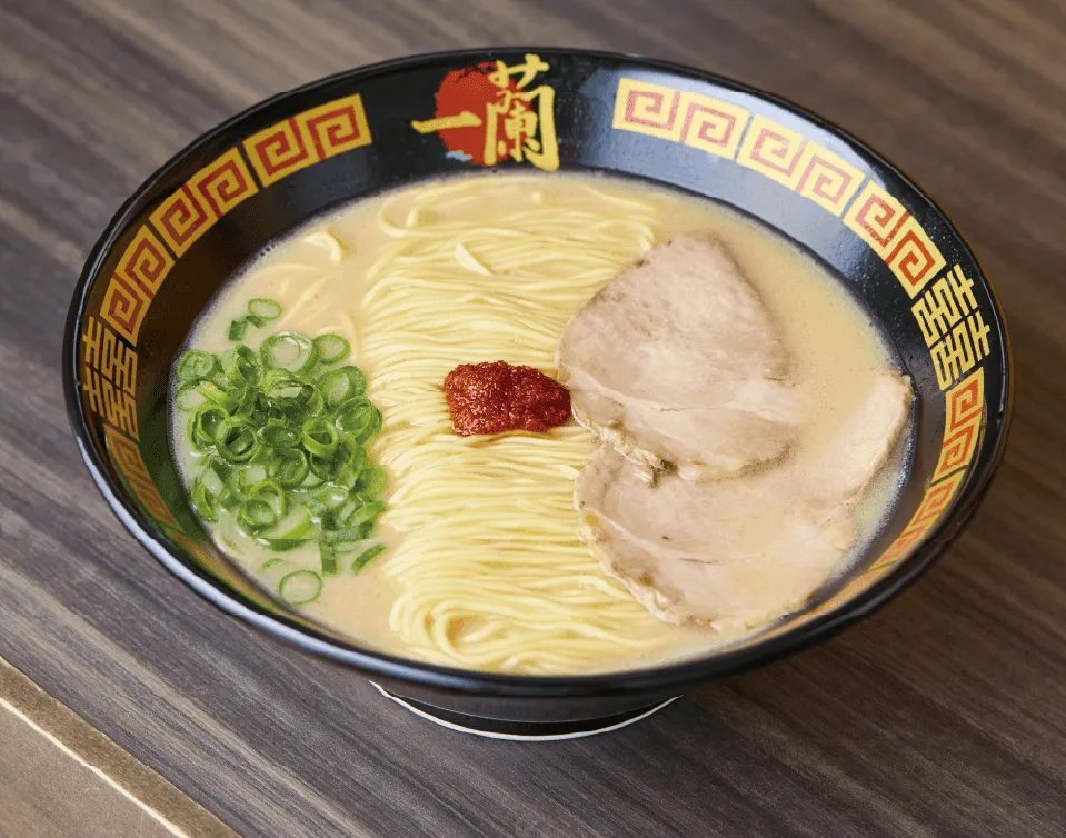 Tonkotsu ramen with thin noodles, chashu, green onions, and spicy red sauce