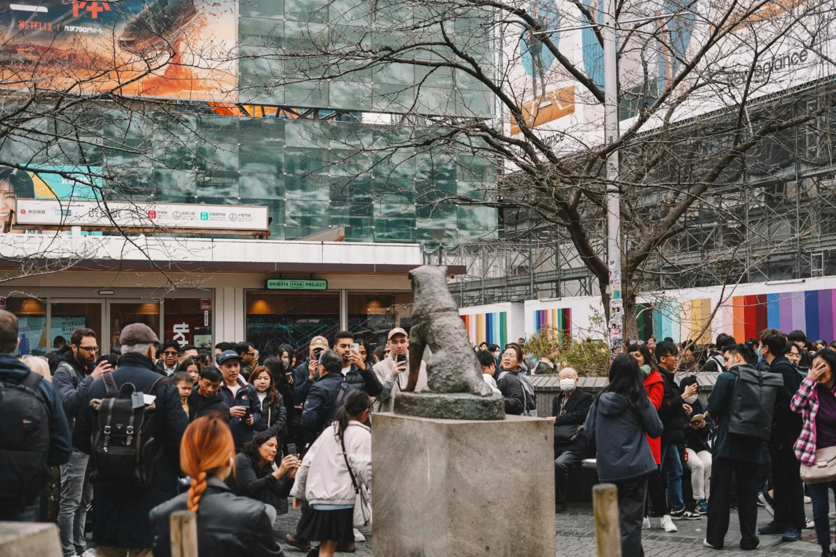 Crowds gathering around the Hachiko statue outside Shibuya Station