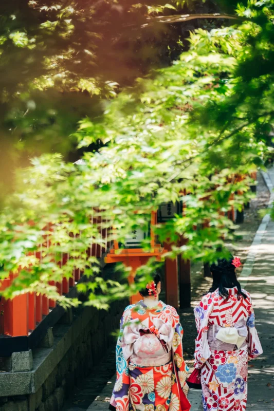 yohei-shimomae-VkYbDqseTy4-unsplash Travelers in colorful kimono walking through a shrine path in Japan, showing cultural sightseeing with local guide support