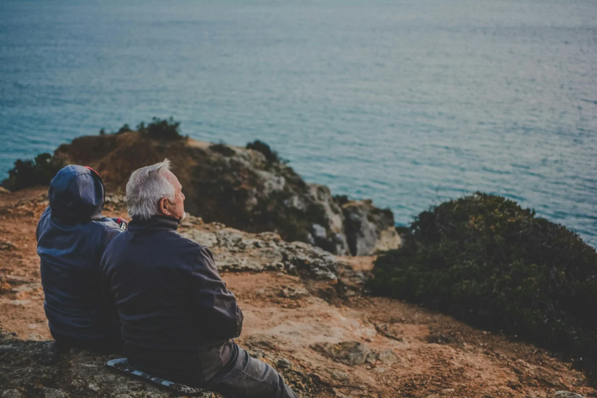 katarzyna-grabowska-sRAWQyoUiVQ-unsplash Senior couple relaxing together during a scenic travel experience