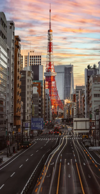 wenhao-ruan-Xbs9DXFUR4U-unsplash Tokyo Tower rising above the city streets at sunset
