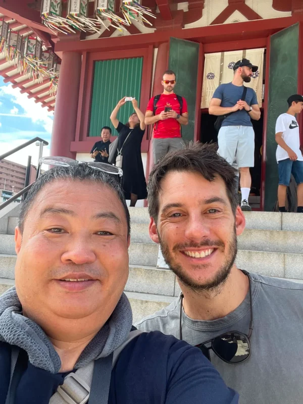 0941b27d-37e3-4d6a-a9bd-5f0ba78a42fc Private tour guide in Japan with a traveler at a traditional temple in Osaka