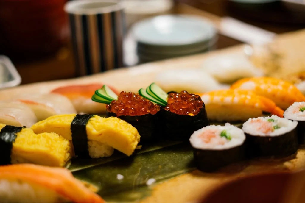 Assorted sushi including salmon, egg and salmon roe