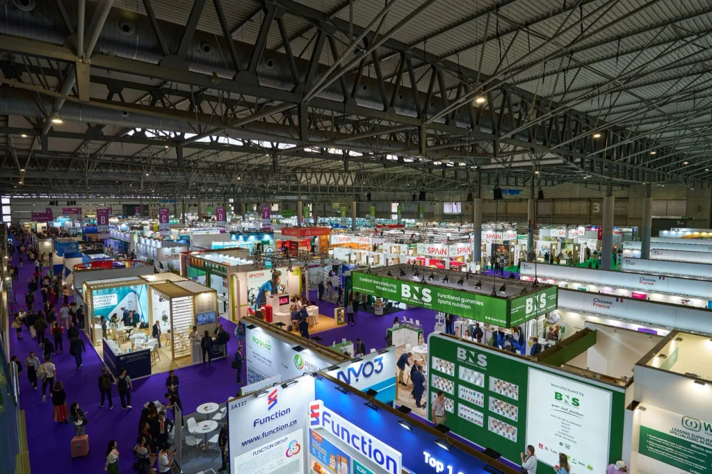 International trade show with exhibition booths and business visitors