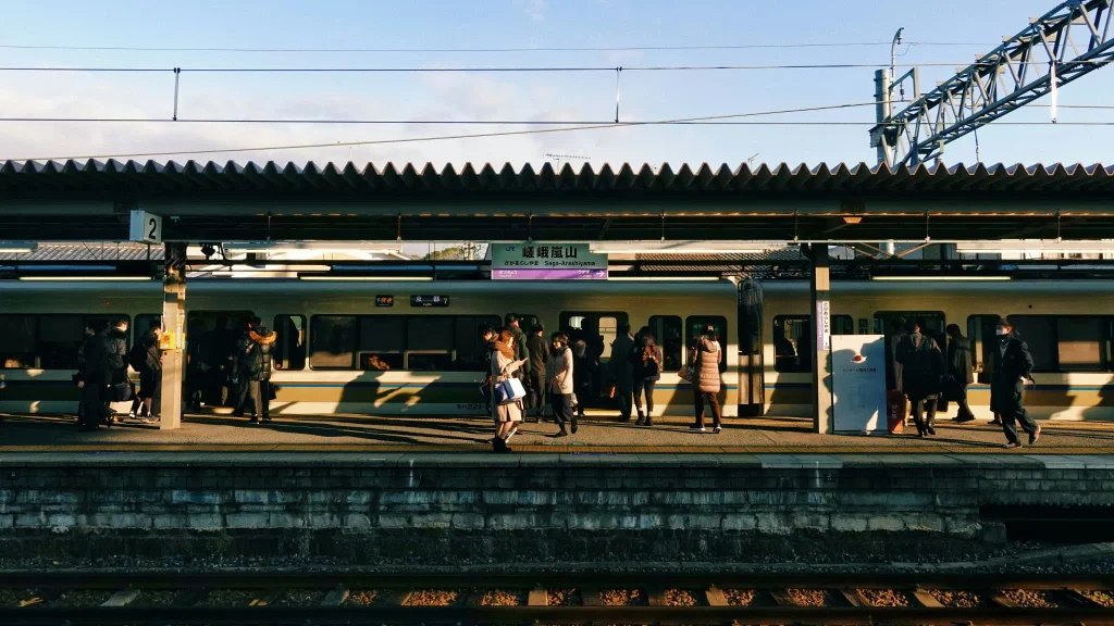 nakaharu-line-Q3HbH--oCdw-unsplash Passengers waiting at Saga-Arashiyama Station in Kyoto