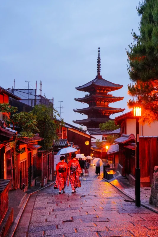 Traditional Kyoto street with Yasaka Pagoda and people in kimono