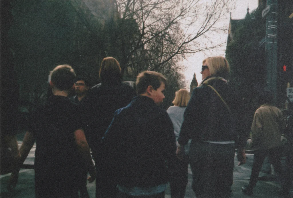 Family with children walking together on a city street