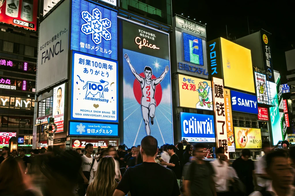 Dotonbori in Osaka at night with illuminated billboards and crowds